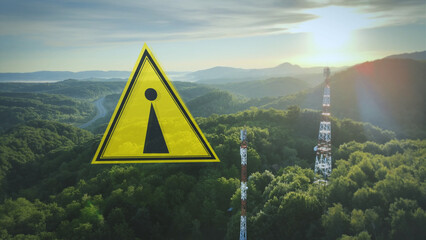 Warning Symbol sign and radio towers, up in the mountains. 3D graphic