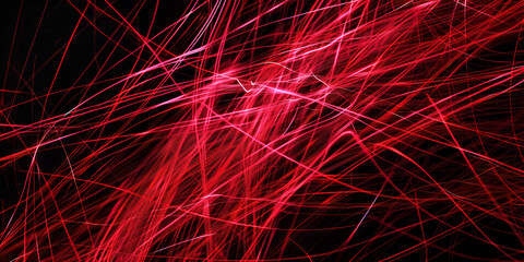 Thin bright red threads in chaotic motion close-up, macro, abstract texture background.
