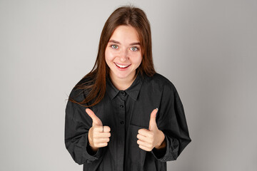 Young Woman Making OK Sign With Fingers