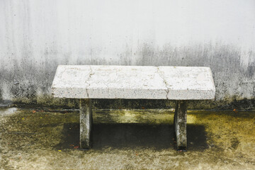Fototapeta premium White cement chairs with water on the floor