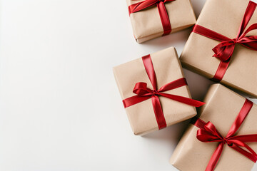 Four brown boxes with red ribbons tied around them