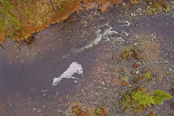 Aerial view of flowing rapids in cloudy weather, Ovre Pasvik National Park, Norway.