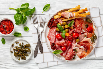italian antipasto plate of cured meat and veggies