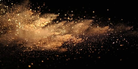 Fototapeta premium a brown splash painting on black background, brown powder dust paint beige brown explosion explode burst isolated splatter abstract. brown smoke or fog particles explosive special effect