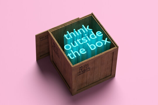 The phrase think outside the box in a wooden crate.