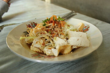 We call this one kupat tahu is a typical food from Magelang, Java, Indonesia