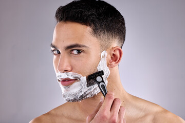 Beauty, portrait and shaving beard with man in studio on gray background for grooming or skincare....