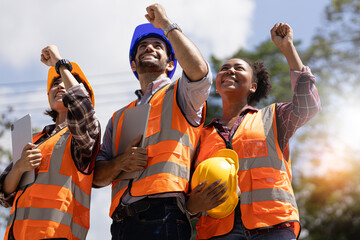 Construction worker, hands and thumbs up by team at construction site, happy with goal and vision. Success, thank you and engineer collaboration by group of workers show support for building project