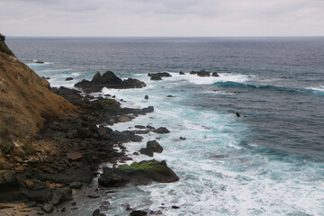 waves crashing on rocks