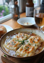 Maultaschen - Swabian ravioli filled with meat, spinach, and onions, served in broth
