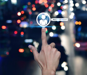 Hand pressing businessman with magnifying glass icon over blur colourful night light traffic jam...