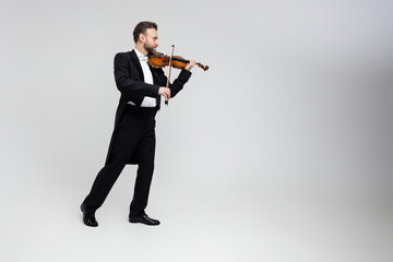 Musician man with violin performing concert