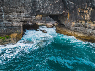 Boca do Inferno (Devil's Mouth) in Cascais is a huge grotto in the coastal cliffs of Portugal....