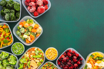 Preparing food for the winter, freezing fresh vegetables in the summer in the refrigerator, various frozen vegetables in plastic dishes on a green background