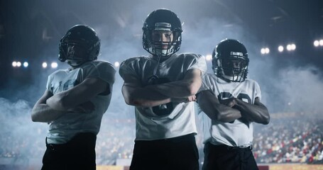 American Football Players Walking in a Stadium Together as an United Team. Teammates with Championship Ambitions Posing for Camera, Smiling. Diverse Group of Male Athletes Ready for Game Day
