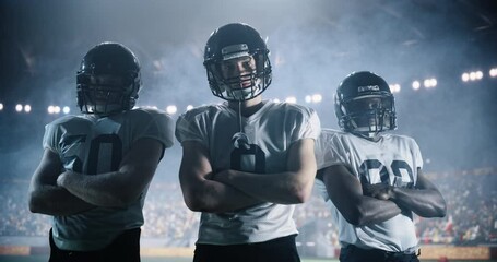 Cinematic Portrait of a Three Diverse Athletic Football Players Standing Confidently on the Field, Posing Crossed Arms and Looking at Camera. Professional Footballers Before a Championship Game