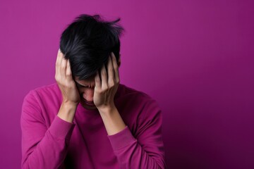 Magenta background sad asian man realistic person portrait of young teenage beautiful bad mood expression boy Isolated on Background depression anxiety fear burn out