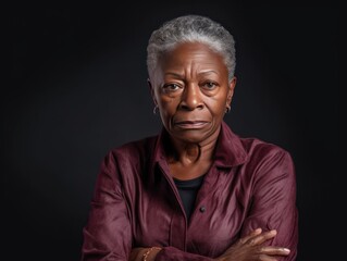Maroon background sad black american independant powerful Woman realistic person portrait of older mid aged person beautiful bad mood expression