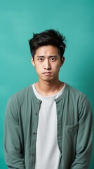Mint background sad asian man realistic person portrait of young teenage beautiful bad mood expression boy Isolated on Background depression anxiety