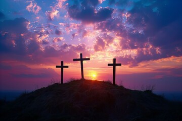 Three crosses on hill with sunset in background