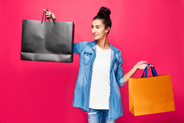 Young woman on pink background