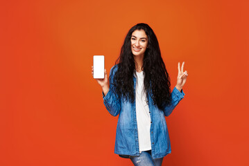 Young woman on orange background