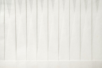Closeup view of white wooden wall