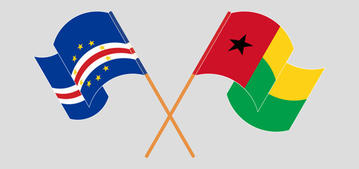 Crossed and waving flags of Cape Verde and Guinea-Bissau