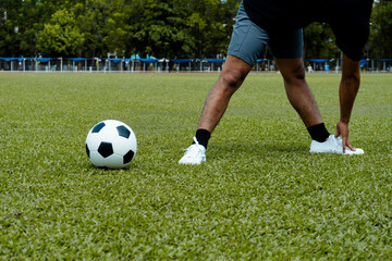 Football players get fit before kicking the ball.