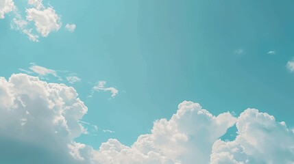 A light blue sky with white clouds