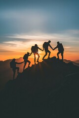 Obraz premium People holding hands and working together to climb to the top of a mountain where the sunrise rises