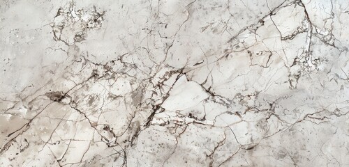 A detailed closeup of the surface texture of light grey marble, showcasing its natural veining and smooth finish to provide design inspiration