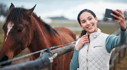 Fototapeta premium Smile, woman and selfie at horse farm outdoor for social media, internet or jockey blog for photography in nature. Happy, person and picture with equestrian animal in countryside field for influencer