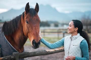 Happy, girl and pet horse on farm for equestrian, training or adventure in countryside. Woman, care...