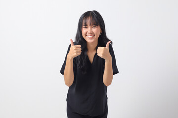 Portrait of attractive Asian woman in casual shirt making thumb up hand gesture, saying good job. Businesswoman concept. Isolated image on white background