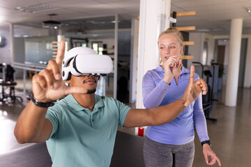 Diverse physical therapist colleagues assisting in rehab gym rehabilitation center