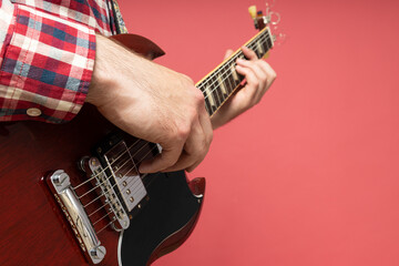 A man plays a beautiful guitar close-up