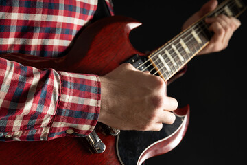 A man plays a beautiful guitar close-up
