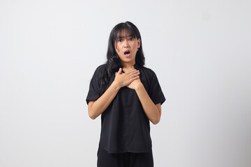 Portrait of attractive Asian woman in casual shirt making shocked hand gesture, showing surprised and scared expression. Isolated image on white background