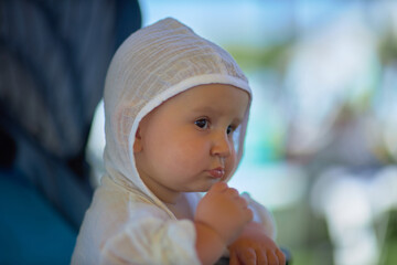 A baby is a happy baby in the first months of life, crawling around the house, smiling.