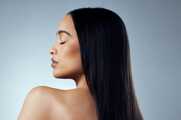 Haircare, woman and back for keratin treatment, growth and wellness isolated in studio. Female...
