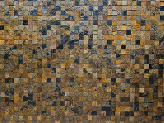 Real brown rock stone wall design background texture tile with mosaic technique in square strong...