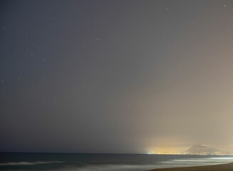 Night beach with fine brown sand. Seascape. Inspiring and relaxing. Gandia.