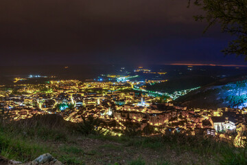 Spectacular views of the medieval city of Cuenca from the top of a viewpoint at night.