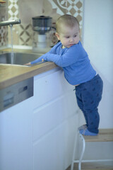 Little Boy Standing on Kitchen Counter