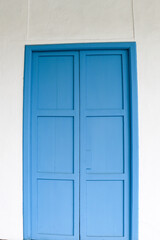 blue door with shutters