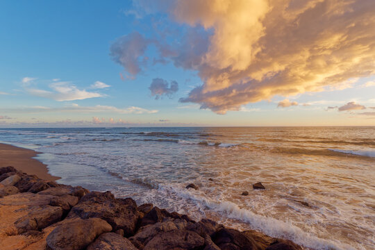 Beautiful sunrise at Kekaha Beach Park, Island of Kauai, Hawaii.