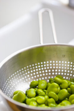 Broad Beans Draining in Colander
