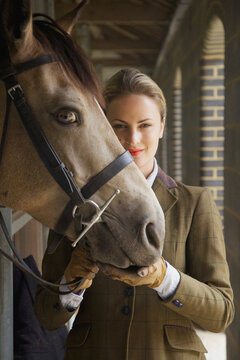 Woman in Riding Outfit with Horse
