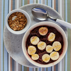 Brazilian acai served with slices of banana and honey